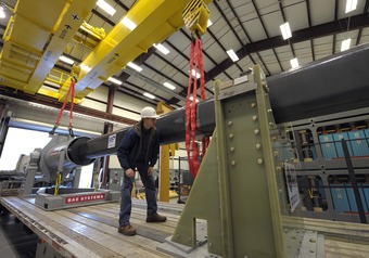 A worker makes final checks