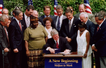 Former President Bill Clinton signing welfare reform