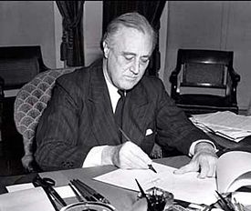 President Roosevelt signing the Lend-Lease Act