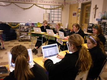 Students Using Laptops in Classroom
