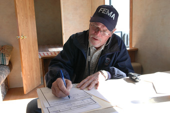 A FEMA Employee Fills Out Paperwork