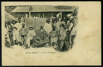 King N'Diagaye, a local chief near Dakar Senegal, receiving a French Administrator. c.1910.