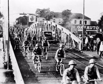  Japanese troops on bicycles advance into Saigon, ca. 1941.